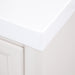 Corner detail on Bolivar 49 inch beige dresser-style single-sink bathroom vanity with 6 drawers and white sink top