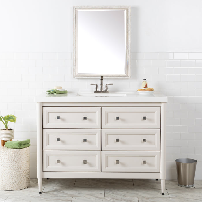 Bolivar 49 inch cream-finish dresser-style single-sink bathroom vanity with 6 drawers and white sink top installed in bathroom