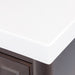 Corner detail on Bolivar 49 inch dark woodgrain dresser-style single-sink bathroom vanity with 6 drawers and white sink top