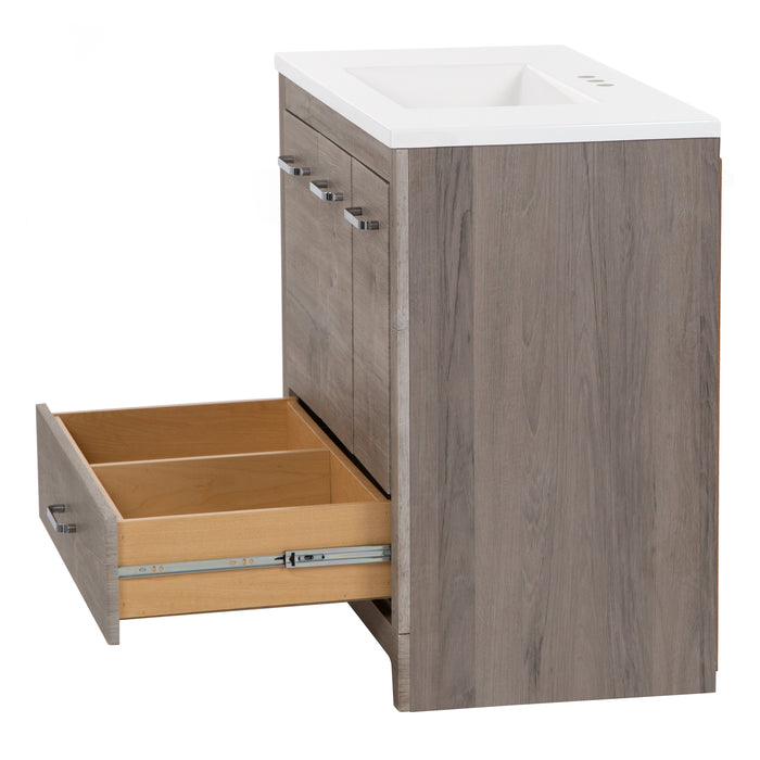 Side view with open base drawer on Breena 36.5 in single-sink vanity with woodgrain finish, 3 doors, 1 drawer, interior shelf, polished chrome hardware, and white sink top