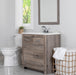 30.25 in Breena half-bath vanity with woodgrain laminate finish, 2-door cabinet, base drawer, chrome hardware installed in bathroom with faucet and mirror