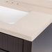 Close-up view of Brooksley natural stone-look warm-toned predrilled vanity top with white sink
