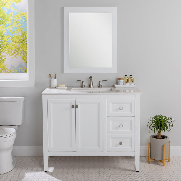 Cartland 43-in white bathroom vanity with 2-door cabinet, 3 drawers, garnite-look sink top installed in bathroom with faucet and mirror