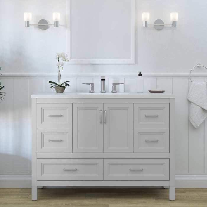 Destan 48 in. bathroom vanity with 4 drawers, cabinet, polished chrome hardware, white sink top installed in bathroom