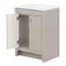 Open door on Lonsdale 24 inch warm gray half-bath vanity with two doors and white sink top