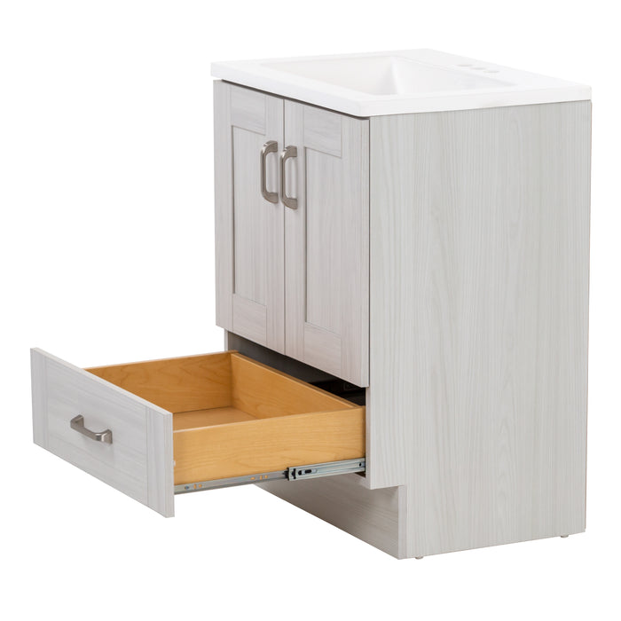  Open bottom drawer on Noelani 24.25” wide powder room vanity features a transitional design with soft-close 2-door cabinet and a full-extension bottom drawer in Elm Sky finish.