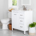 Open back on Tilford white furniture-style bathroom vanity with 1-door cabinet, 3 drawers, silver ash sink top installed in bathroom with faucet and mirror