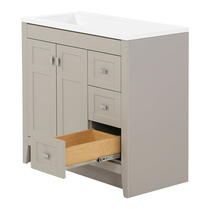Open bottom drawer on Lonsdale 36 inch warm gray powder room vanity with 2 doors, 3 drawers, and white top with offset sink