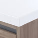 Corner detail on Trente 48 inch 4-door, 4-drawer, hardware-free bathroom vanity with woodgrain finish and white sink top