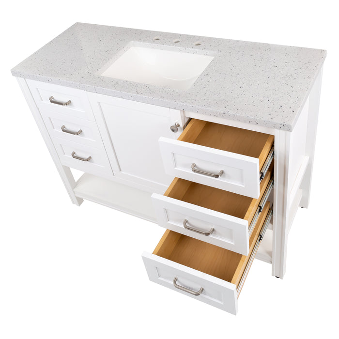 Top view with 3 open drawers on 48 in. Eaton white bathroom vanity with cabinet, 6 drawers, open shelf, adjustable legs, and brushed nickel handles with granite-look sink top