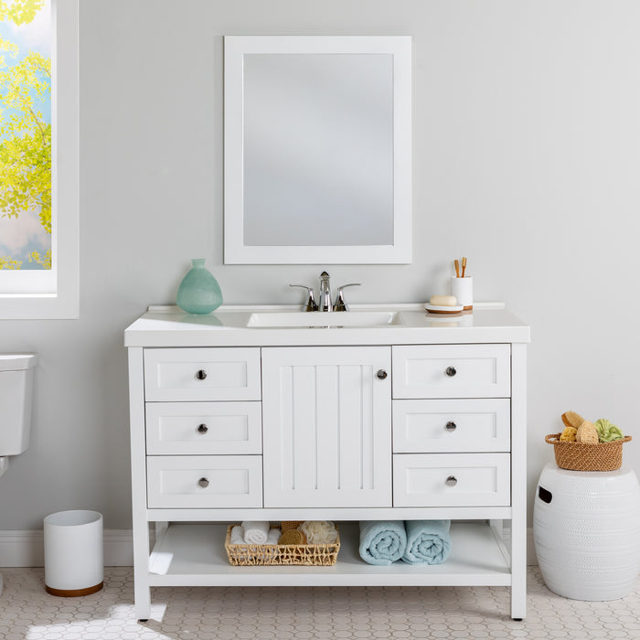 Elvet 49 in white bathroom vanity with 6 drawers, cabinet, open shelf, white vanity top installed in bathroom with faucet & mirror