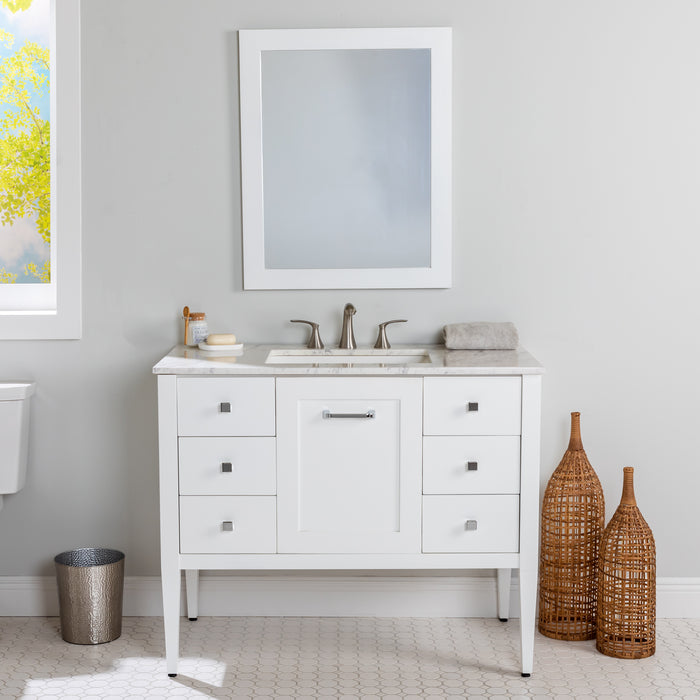 Fordwin 43 in furniture-style white vanity with granite-look sink top, 6 drawers, cabinet installed in bathroom with mirror and faucet