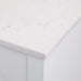 Closeup of countertop on Fordwin 43 in furniture-style white vanity with granite-look sink top, 6 drawers, cabinet