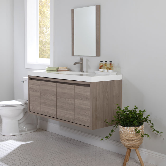 Kelby 48.5" W modern woodgrain floating bathroom vanity installed in bathroom with mirror and plant