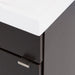 Close-up of corner of Merton 17" W vanity one door dark woodgrain box-style bathroom cabinet