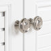 Close view of round, satin nickel door pull hardware on 24.5” wide Rafferty bathroom vanity,