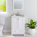 White bathroom vanity with louvered doors and faucet, stone-finish sink top in bathroom