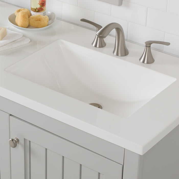 Sink closeup on 61 in. Rhiya gray double-sink bathroom vanity with 3 drawers, 2 cabinets, satin nickel hardware, white sink top