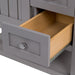 Open lower drawer on Sykes 31 in. sterling gray bathroom vanity with 2 drawers, open shelf, cabinet, and white sink top